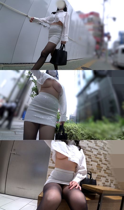 街中を歩く女性のミニ丈シャツから覗く豊かな胸元